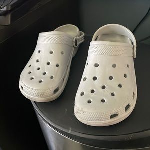 A pair of crocks in good shape, grey. Large/XL size, one strap in back is broken
